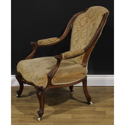 2289 - A Victorian walnut drawing room chair, stuffed-over upholstery, cabriole forelegs, ceramic casters, ... 