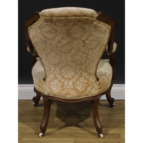 2289 - A Victorian walnut drawing room chair, stuffed-over upholstery, cabriole forelegs, ceramic casters, ... 