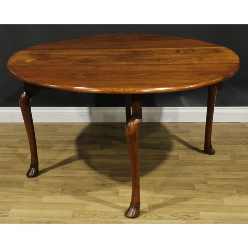 2103 - A George II Revival oak gateleg dining table, oval top with fall leaves, cabriole legs, hoof feet, 7... 