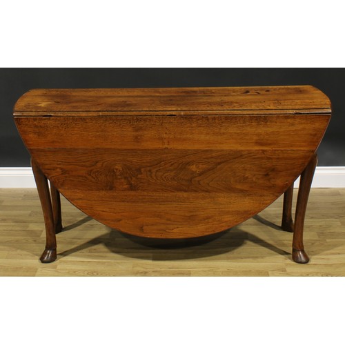 2103 - A George II Revival oak gateleg dining table, oval top with fall leaves, cabriole legs, hoof feet, 7... 