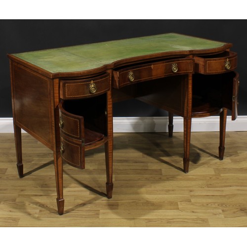 1882 - An Edwardian parcel-satinwood banded mahogany desk, slightly oversailing top with inset tooled and g... 