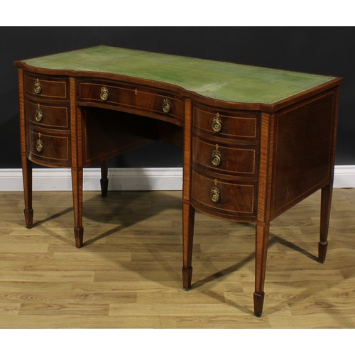 1882 - An Edwardian parcel-satinwood banded mahogany desk, slightly oversailing top with inset tooled and g... 