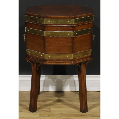 2124 - A George III Revival brass-bound mahogany octagonal cellarette or wine cooler, hinged top, removable... 