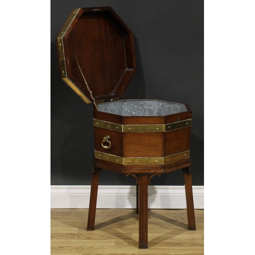 2124 - A George III Revival brass-bound mahogany octagonal cellarette or wine cooler, hinged top, removable... 