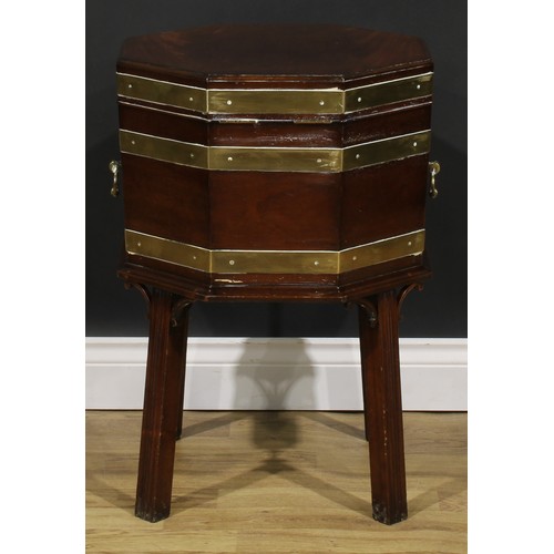 2124 - A George III Revival brass-bound mahogany octagonal cellarette or wine cooler, hinged top, removable... 