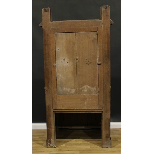 2569 - A substantial Gothic Revival oak throne-form chair, rectangular back, plank seat, carved and applied... 