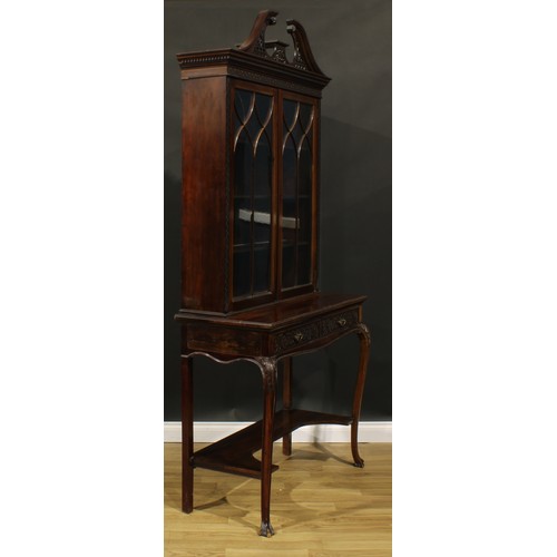 2442 - A Chippendale Revival mahogany display cabinet, fretwork swan neck pediment above a pair of glazed d... 