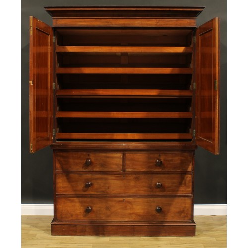 2585 - A Victorian mahogany linen press, concave moulded cornice above a pair of panel doors enclosing five... 