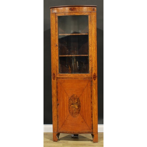 2557 - A Sheraton Revival satinwood and marquetry floor-standing bowfront corner display cabinet, moulded c... 