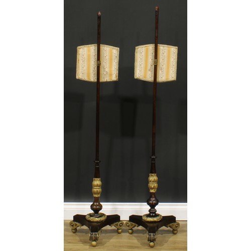 1854 - A near pair of William IV parcel-gilt simulated rosewood pole screens, the largest 147cm high, the b... 