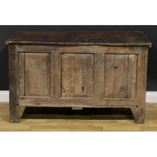 2157 - A late 17th century oak blanket chest, hinged top above a nulled panel front, the stiles carved with... 