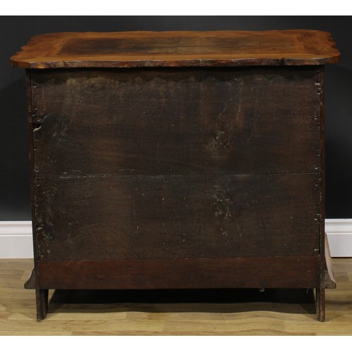 1990 - An 18th century design walnut arc-en-arbalète chest, oak featherbanded top above three long drawers,... 