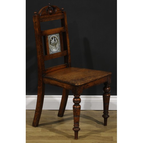 1973 - A pair of late Victorian tile back oak hall chairs, of Shakespearean interest, the Shakespeare serie... 