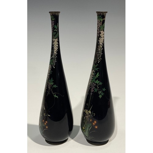 472 - A pair of Japanese cloisonne slender ovoid vases, finely decorated in polychrome with birds amongst ... 