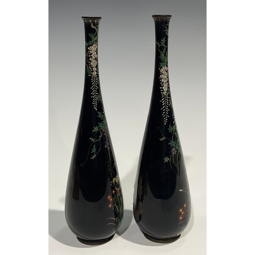 472 - A pair of Japanese cloisonne slender ovoid vases, finely decorated in polychrome with birds amongst ... 