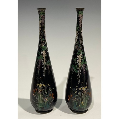 472 - A pair of Japanese cloisonne slender ovoid vases, finely decorated in polychrome with birds amongst ... 