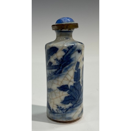 2235 - A Chinese porcelain cylindrical scent bottle, painted in tones of underglaze blue with elder and chi... 