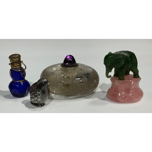 2243 - A Japanese rock crystal bell push, decorated with shamrocks, 5cm in diameter; a Jade Elephant, rose ... 