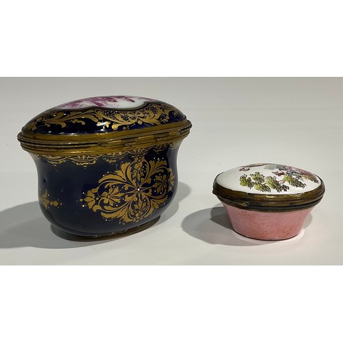 2236 - A French ovoid ceramic and gilt box, decorated with a scene of a lady and gentleman on a blue ground... 