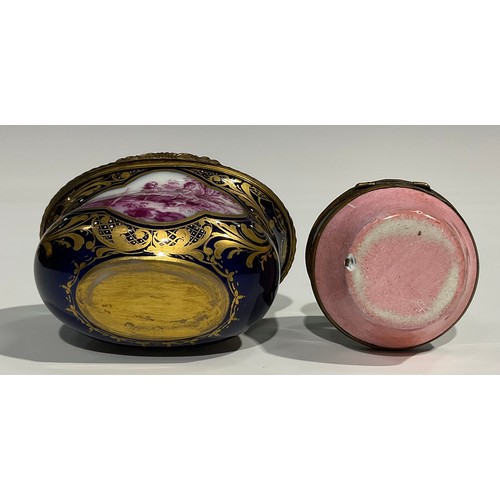 2236 - A French ovoid ceramic and gilt box, decorated with a scene of a lady and gentleman on a blue ground... 