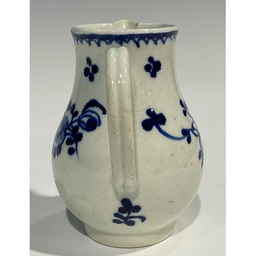 175 - A Liverpool sparrow beak jug, painted in under glaze blue with stylised flowers, crows foot border, ... 