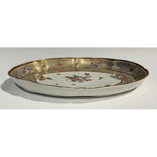 134 - A rare Bristol shaped oval cabaret tray, the central field painted with floral spray, with further f... 