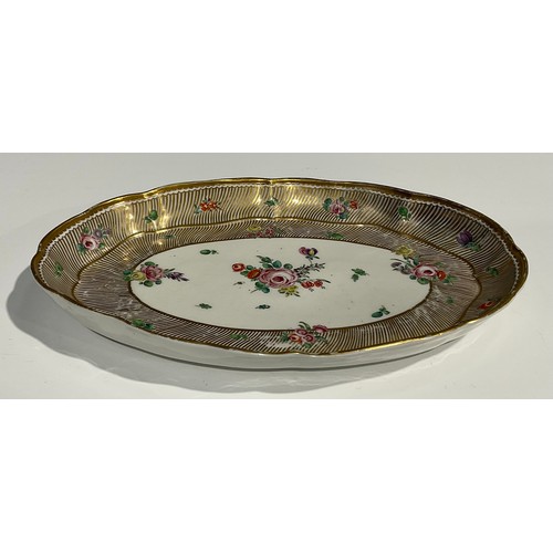 134 - A rare Bristol shaped oval cabaret tray, the central field painted with floral spray, with further f... 