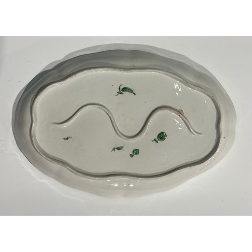 134 - A rare Bristol shaped oval cabaret tray, the central field painted with floral spray, with further f... 