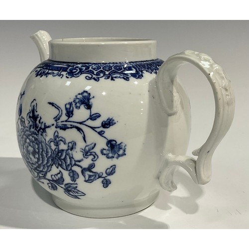 133 - A rare Bristol blue and white transfer printed globular teapot decorated with a spray of flowers und... 