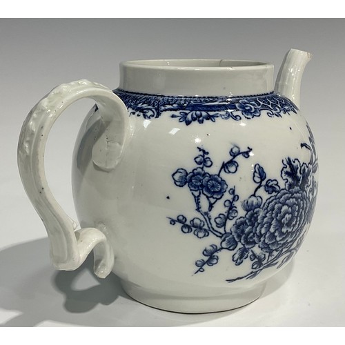 133 - A rare Bristol blue and white transfer printed globular teapot decorated with a spray of flowers und... 