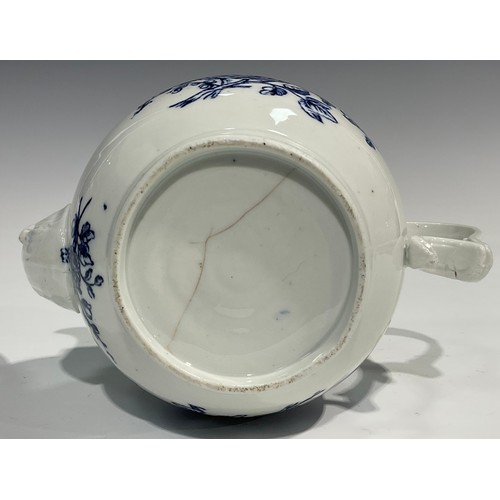 133 - A rare Bristol blue and white transfer printed globular teapot decorated with a spray of flowers und... 