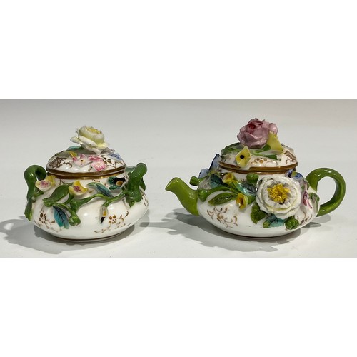 160 - An English porcelain miniature teapot and sucrier, probably Minton, both encrusted with colourful fl... 