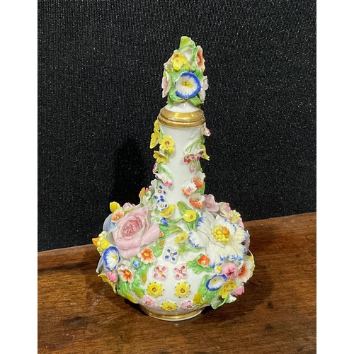 240 - A Derby porcelain scent bottle and stopper, encrusted with colourful flowers, crown and D mark in re... 