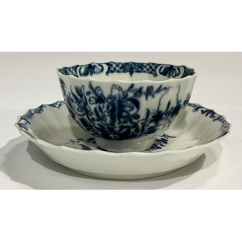 210 - A Worcester fluted Hollow Rock Lily pattern tea bowl and saucer, decorated in underglaze blue with r... 