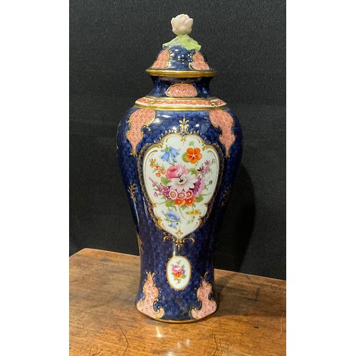 189 - A Royal Worcester baluster vase and cover, by Ernest Phillips, painted with panels of flowers on a b... 