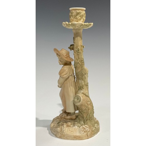 195 - A Royal Worcester figural candlestick, in the manner of Hadley, of a girl leaning against a tree, in... 