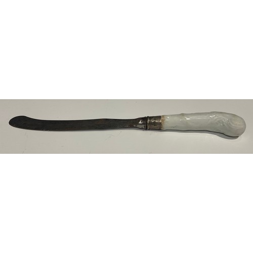 188 - A rare Worcester Blanc de Chine knife handle, pistol grip, moulded with scrolls, the steel blade sta... 