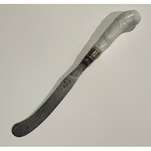 188 - A rare Worcester Blanc de Chine knife handle, pistol grip, moulded with scrolls, the steel blade sta... 