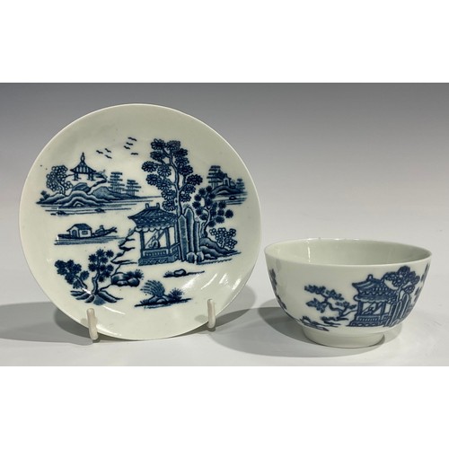 228 - A Worcester The Man in the Pavilion pattern tea bowl and saucer, printed with pagoda, trees, and roc... 