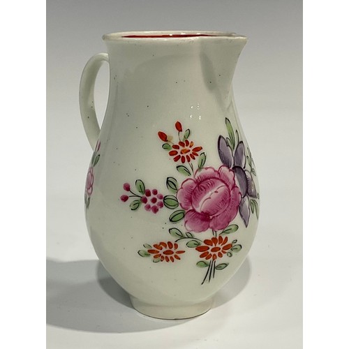 226 - A Worcester sparrow beak jug, painted with flowers, internal pink diaper border, ribbed loop handle,... 