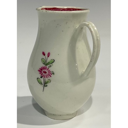 226 - A Worcester sparrow beak jug, painted with flowers, internal pink diaper border, ribbed loop handle,... 