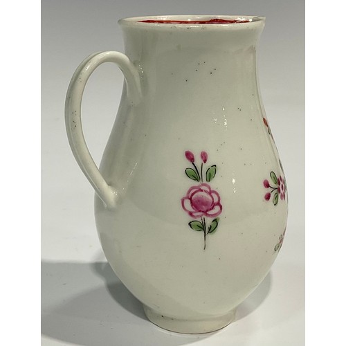 226 - A Worcester sparrow beak jug, painted with flowers, internal pink diaper border, ribbed loop handle,... 