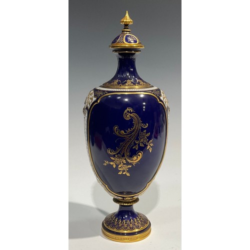 200 - A Royal Worcester ovoid pedestal vase and cover, in the manner of George Johnson, painted with a car... 