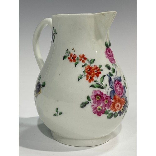 225 - A Worcester sparrow beak jug, painted with a floral bouquet and other scattered flowers, 10.5cm high... 