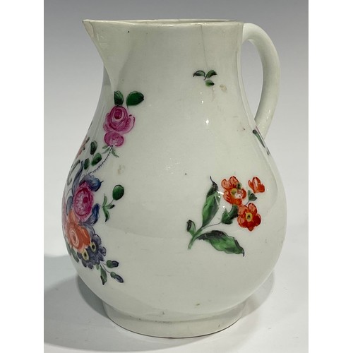 225 - A Worcester sparrow beak jug, painted with a floral bouquet and other scattered flowers, 10.5cm high... 