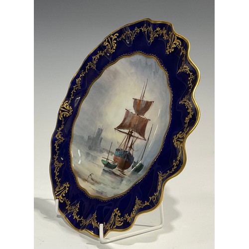 266 - A Royal Crown Derby wavy edged cabinet plate, painted by W. E. J. Dean, signed, the field painted wi... 