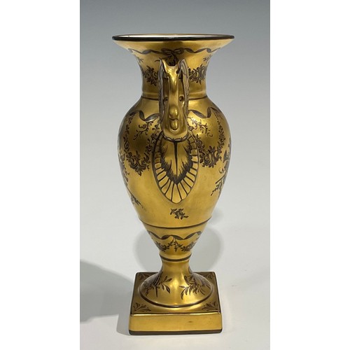 284 - A 19th century Paris porcelain two handled pedestal vase, painted en-grisaille with musical trophies... 