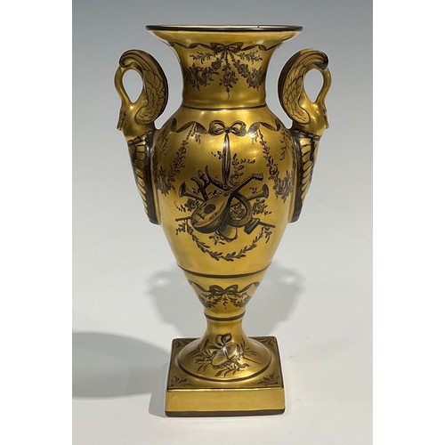 284 - A 19th century Paris porcelain two handled pedestal vase, painted en-grisaille with musical trophies... 