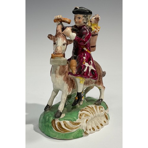 331 - A pair of early 19th century Staffordshire figures, The Welsh Tailor and Wife, both seated astride a... 