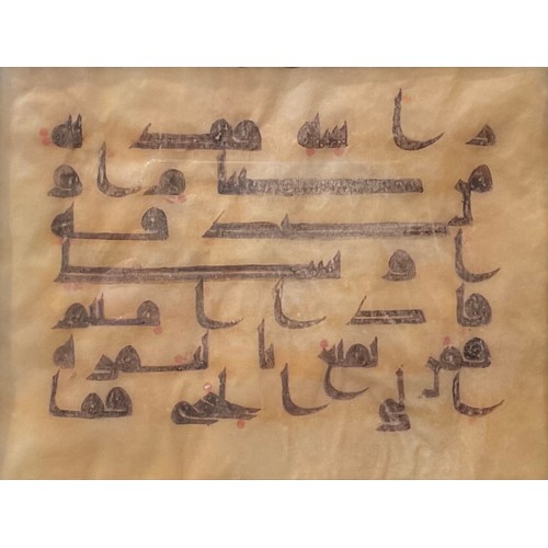 466 - Islamic Calligraphy - a Koran [Quran] leaf, in monumental Kufic script, in ink manuscript on vellum,... 